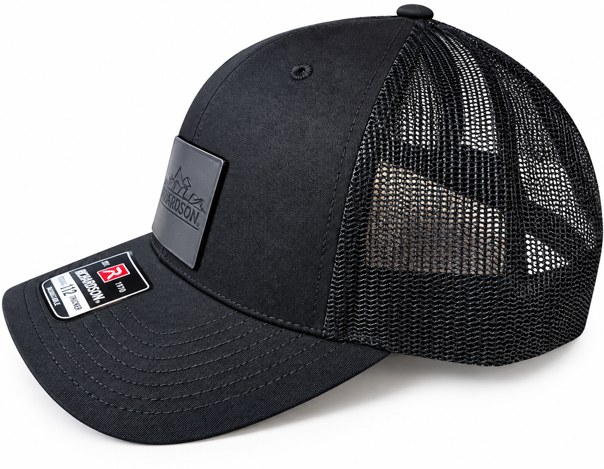 Black trucker hat with silver logo