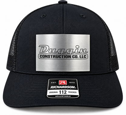 Black trucker hat with silver logo